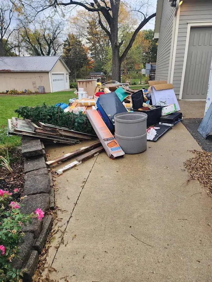 Dumpster being loaded with debris for 3 Yard Dumpster Rental in Blytheville